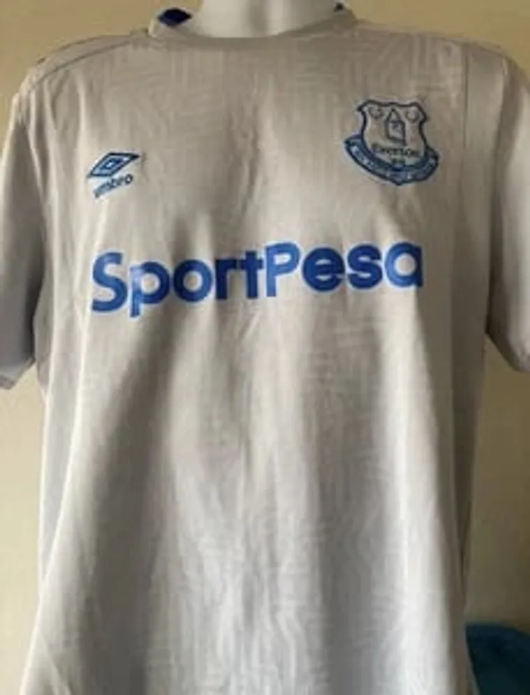 White Everton football shirt with SportPesa sponsor on a mannequin